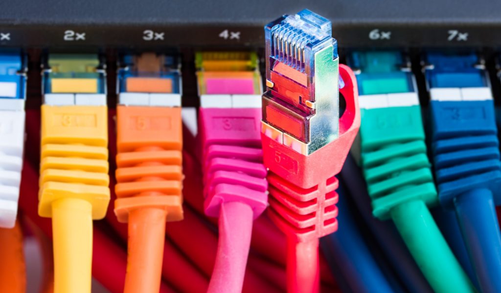 Colorful network cables connected to a switch